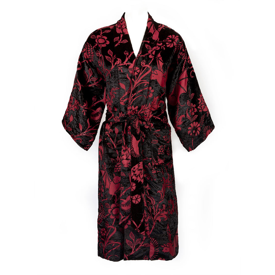 Burgundy red and black velvet robe with a gothic botanical pattern featuring bats and venus fly traps. On a mannequin form on a white background. 