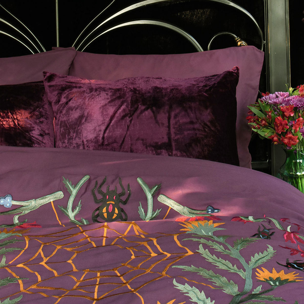 Sin in Linen's Forest Witch Duvet Cover in hues of purple, gold, and black. Gothic botanical decor paired with velvet accents.