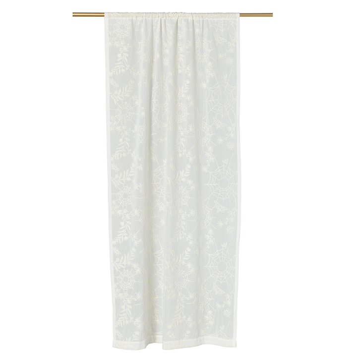 Ivory embroidered curtain with spider web lace detailing for a cottagecore look.