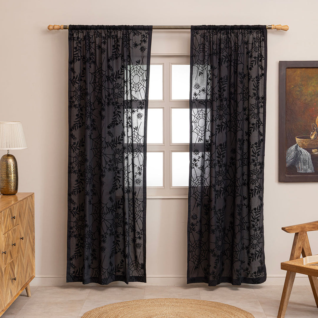 Black cotton curtains with black spider web embroidery. Curtains are hung up in. a living room. Cottagecore and whimsigoth decor by Sin in Linen.