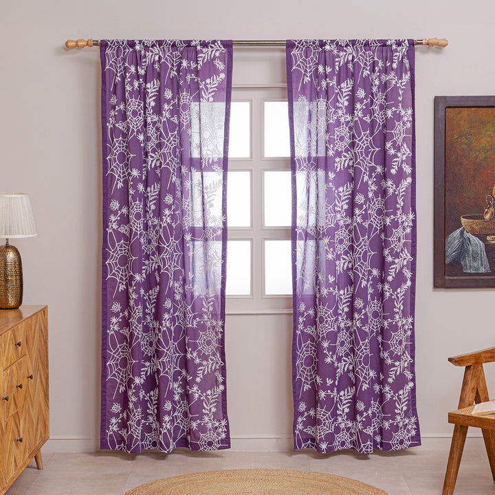 Purple cotton curtains with ivory spider web embroidery. Curtains are hung up in a living room. Cottagecore and whimsigoth decor by Sin in Linen.