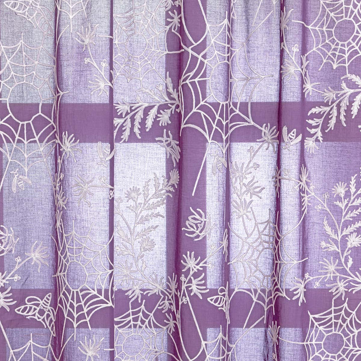 Close up of purple cotton curtains with ivory spider web embroidery. Cottagecore and whimsigoth decor by Sin in Linen.
