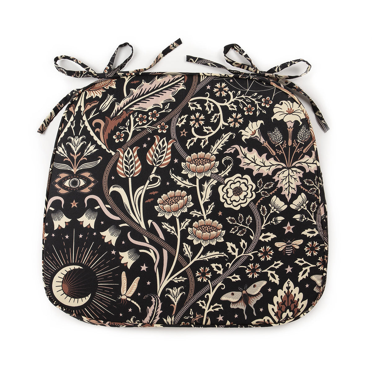 A dark floral chair pad with a black background