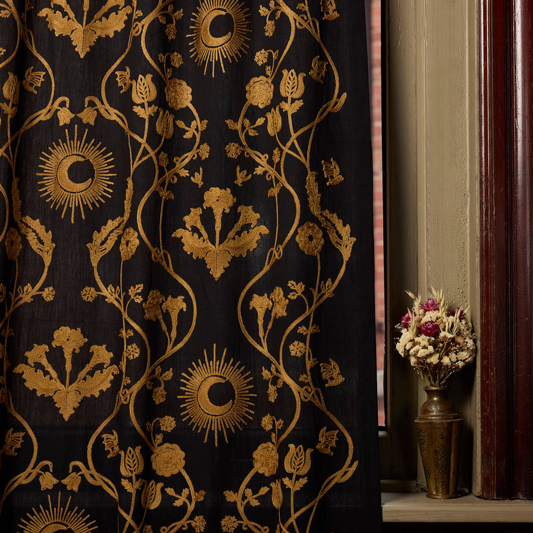 Night Garden Embroidered Curtain from Sin in Linen. Bronze motifs of moons and florals on a black backdrop. Witchy, dark decor. 
