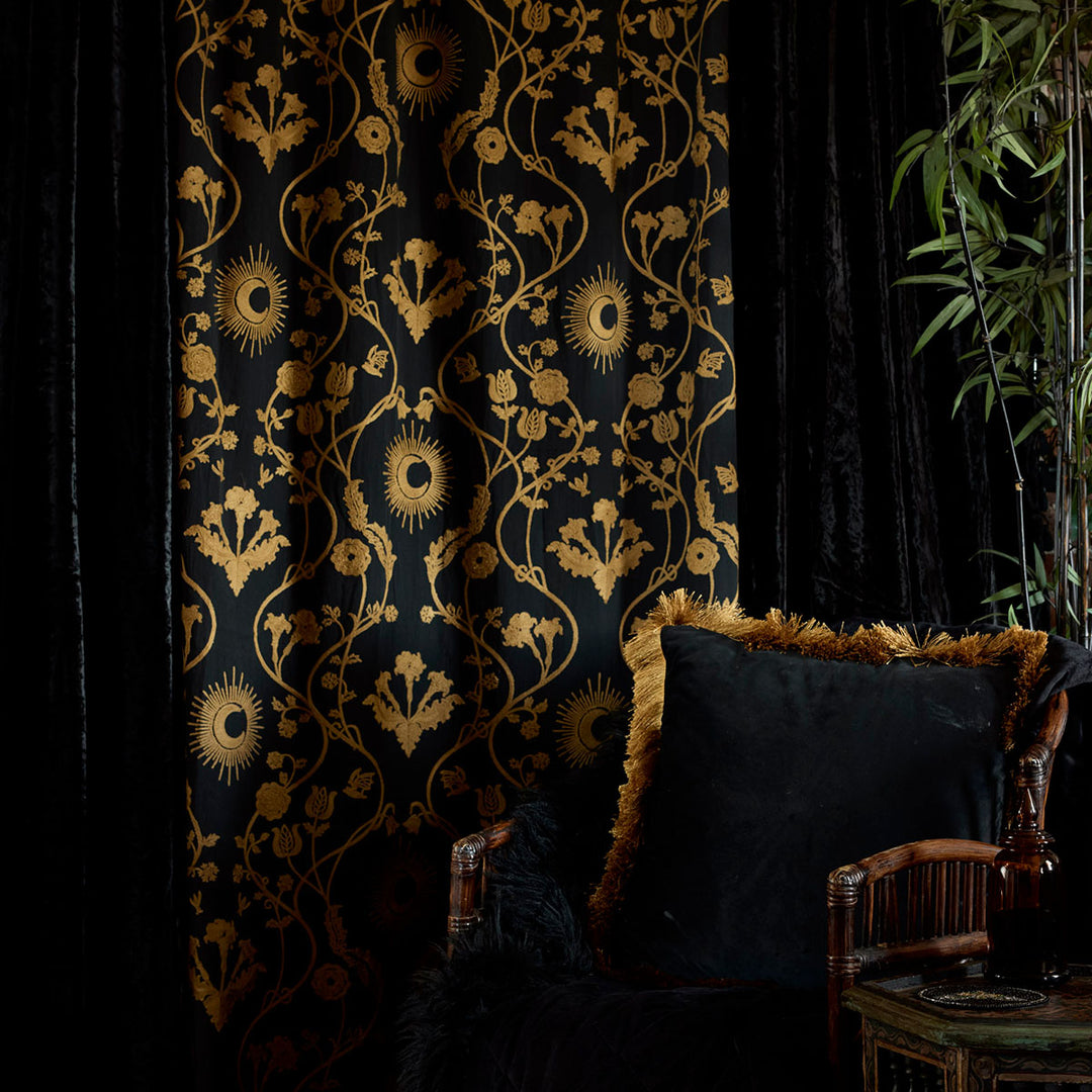 Night Garden Embroidered Curtain from Sin in Linen. Bronze motifs of moons and florals on a black backdrop. Witchy, dark decor. 