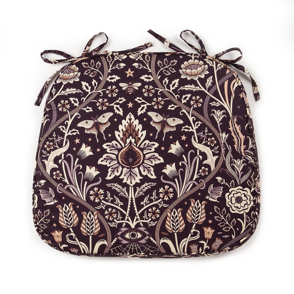 A dark floral chair pad with a purple background