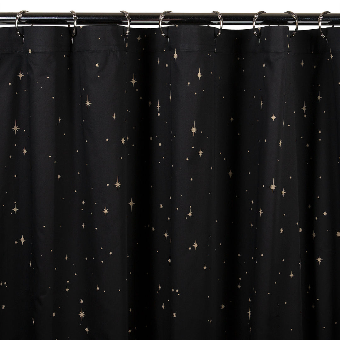 Celestial bohemian shower curtain featuring bronze stars.