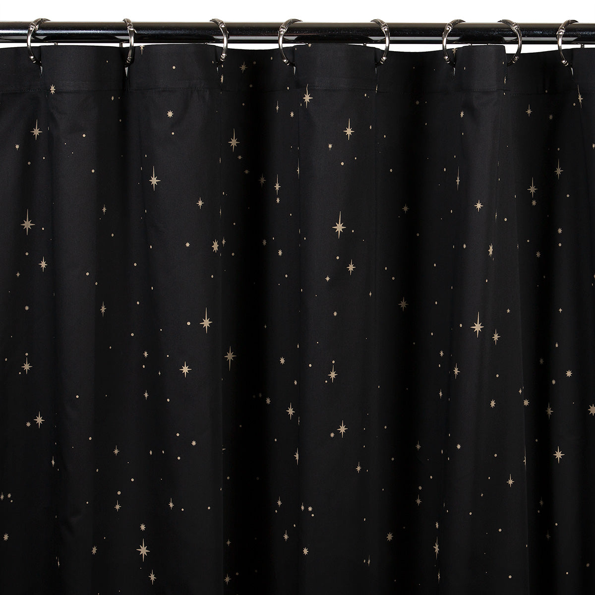 Celestial bohemian shower curtain featuring bronze stars.