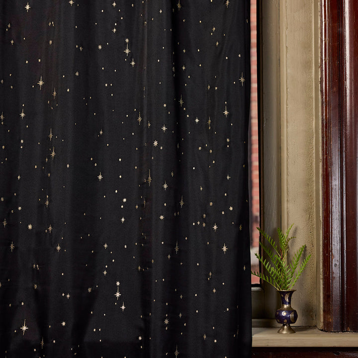 Sin in Linen's Night Sky Embroidered Curtain in Black with gold embroidered stars. 