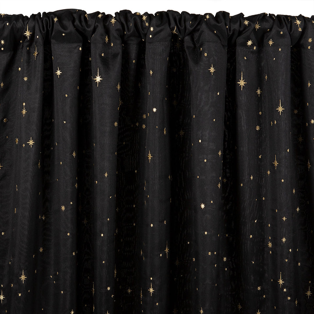 Black semi-sheer curtain with embroidered gold star pattern