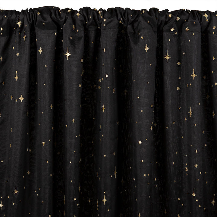 Black semi-sheer curtain with embroidered gold star pattern