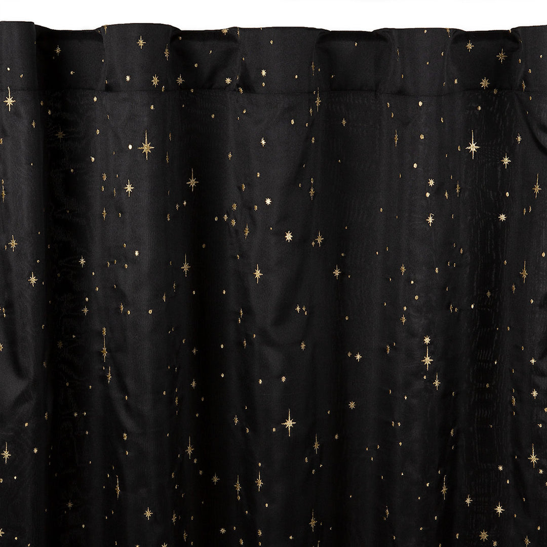 Black semi-sheer curtain with embroidered gold star pattern