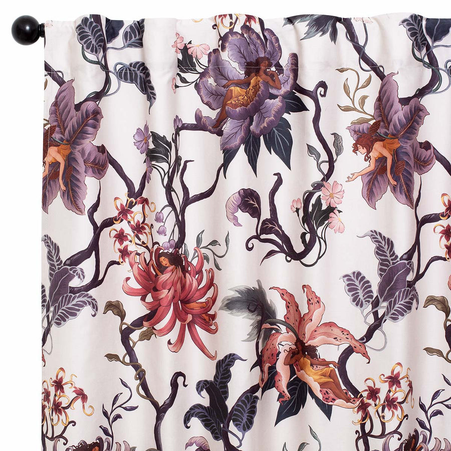 Romantic floral bedding by Sin in Linen. Nymphs bloom out of flowers on a light background on these fairy inspired curtains and valances. Hues of lilac and rose abound. 