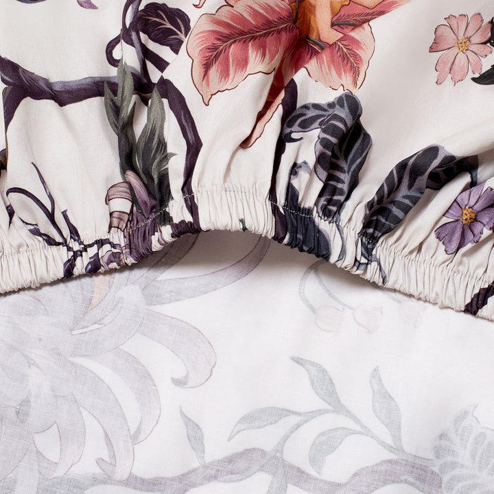 Romantic floral bedding by Sin in Linen. Nymphs bloom out of flowers on a light background in this fairy inspired bedding collection. Hues of lilac and rose abound. 