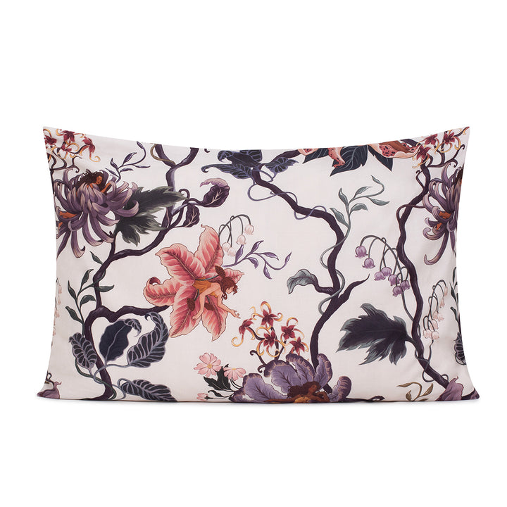 Romantic floral bedding by Sin in Linen. Nymphs bloom out of flowers on a light background on these fairy inspired pillowcases & shams. Hues of lilac and rose abound. 