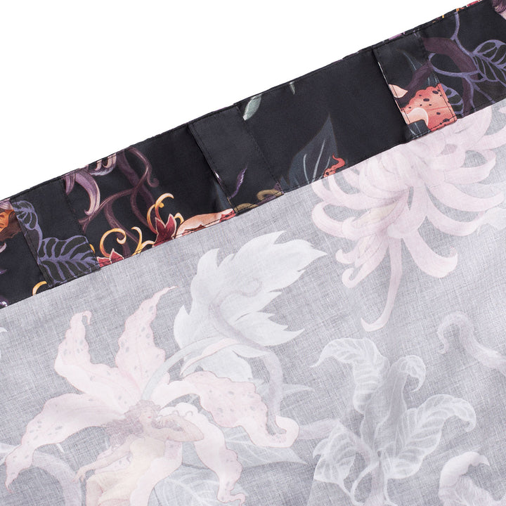Romantic floral decor by Sin in Linen. Nymphs bloom out of flowers on a dark background on these fairy inspired curtains. Showcases the curtain tab and rod pocket design. 