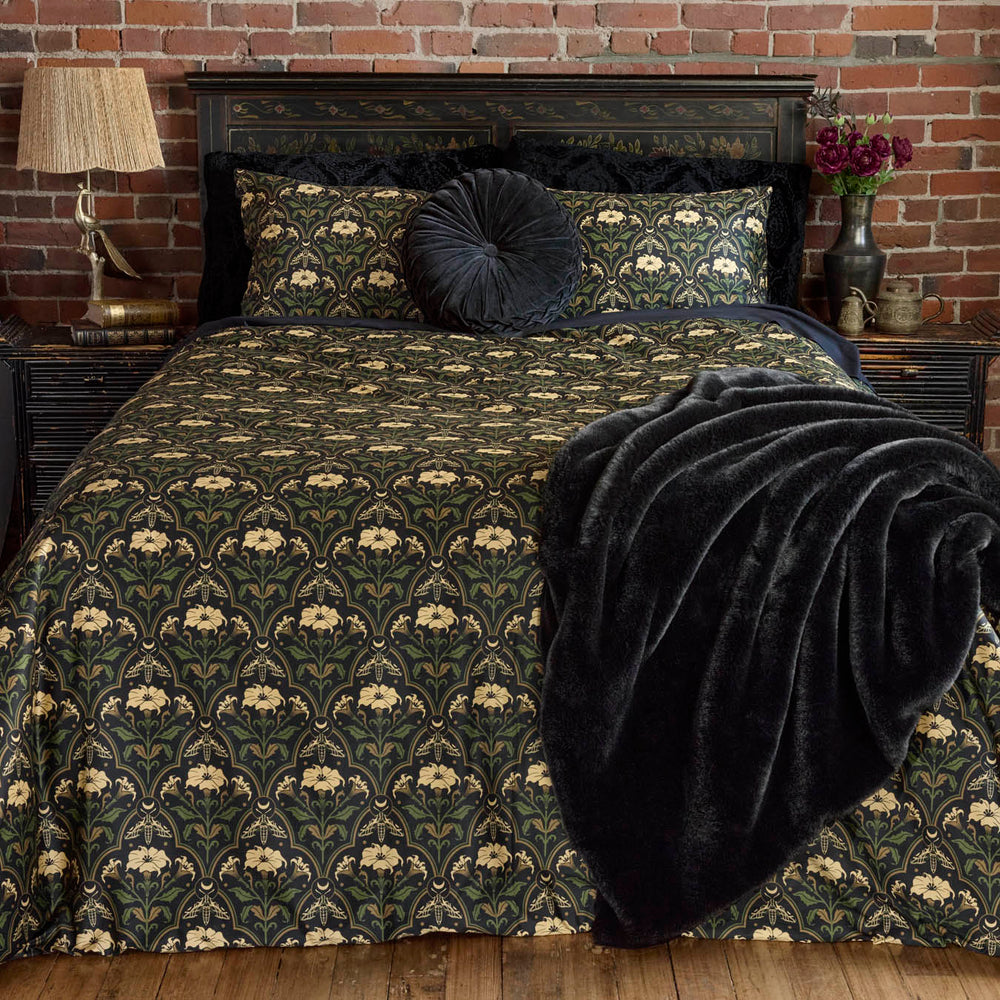 Gothic Botanical Art Deco Bedding with the Datura Deco print featuring moths, gilded accents, and blooming florals. 