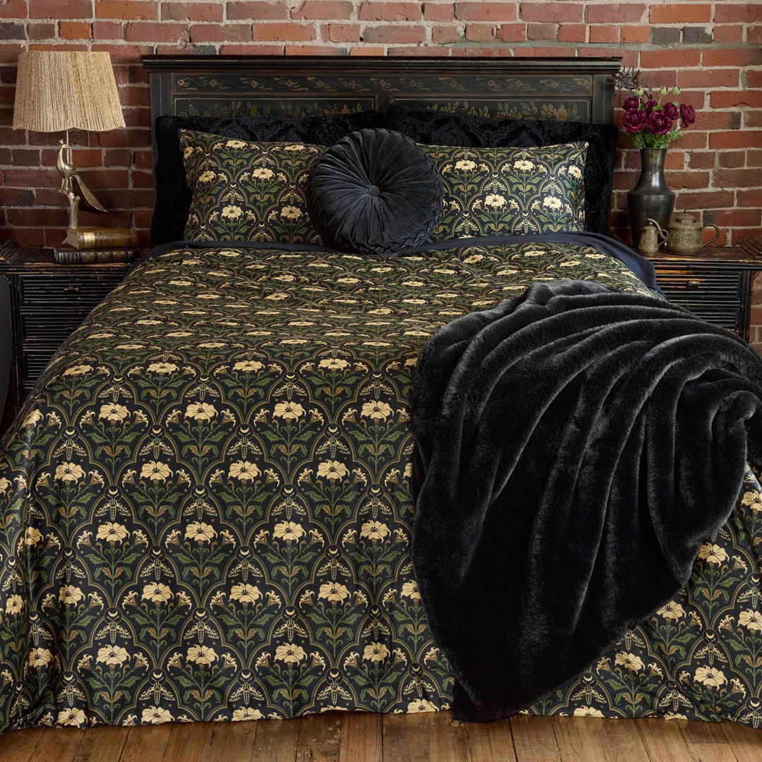 Gothic Botanical Art Deco Bedding with the Datura Deco print featuring moths, gilded accents, and blooming florals. 