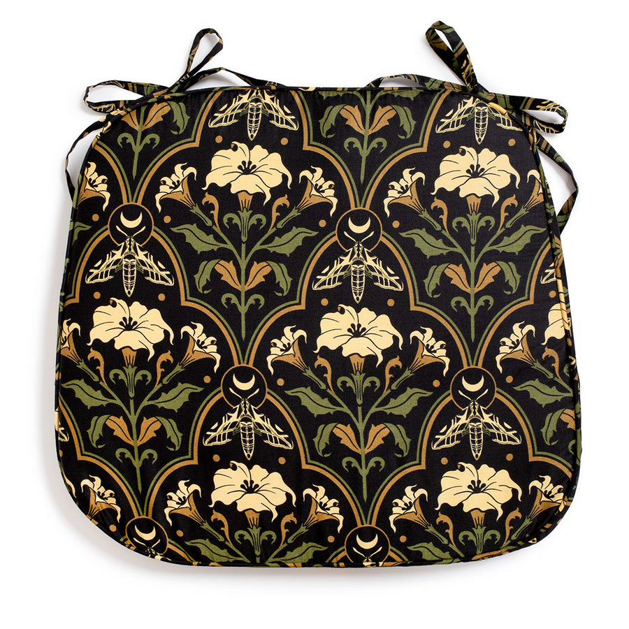 Datura Deco chair pads by Sin in Linen on a white background. Gothic Botanical, witchy table decor featuring datura blooms, moths, and moons. 