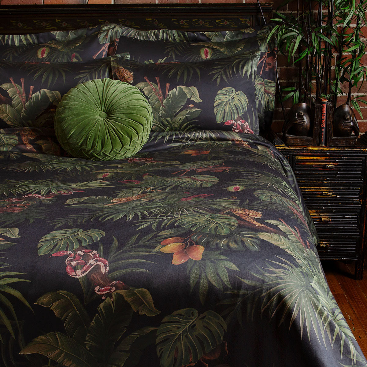 Sin in Linen's Tropical Gothic bedding and decor collection, Jungle Noir. Featuring lush botanicals, leopards, snakes, and vintage inspired elements, this 100% cotton collection includes duvet covers, pillowcases, curtains, and shower curtains. 