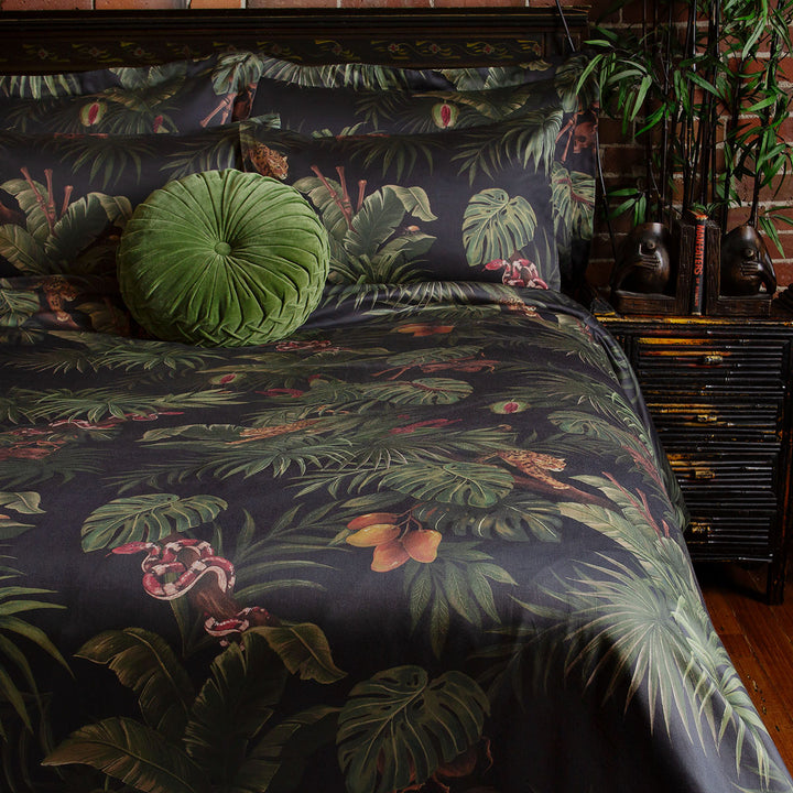 Sin in Linen's Tropical Gothic bedding and decor collection, Jungle Noir. Featuring lush botanicals, leopards, snakes, and vintage inspired elements, this 100% cotton collection includes duvet covers, pillowcases, curtains, and shower curtains. 