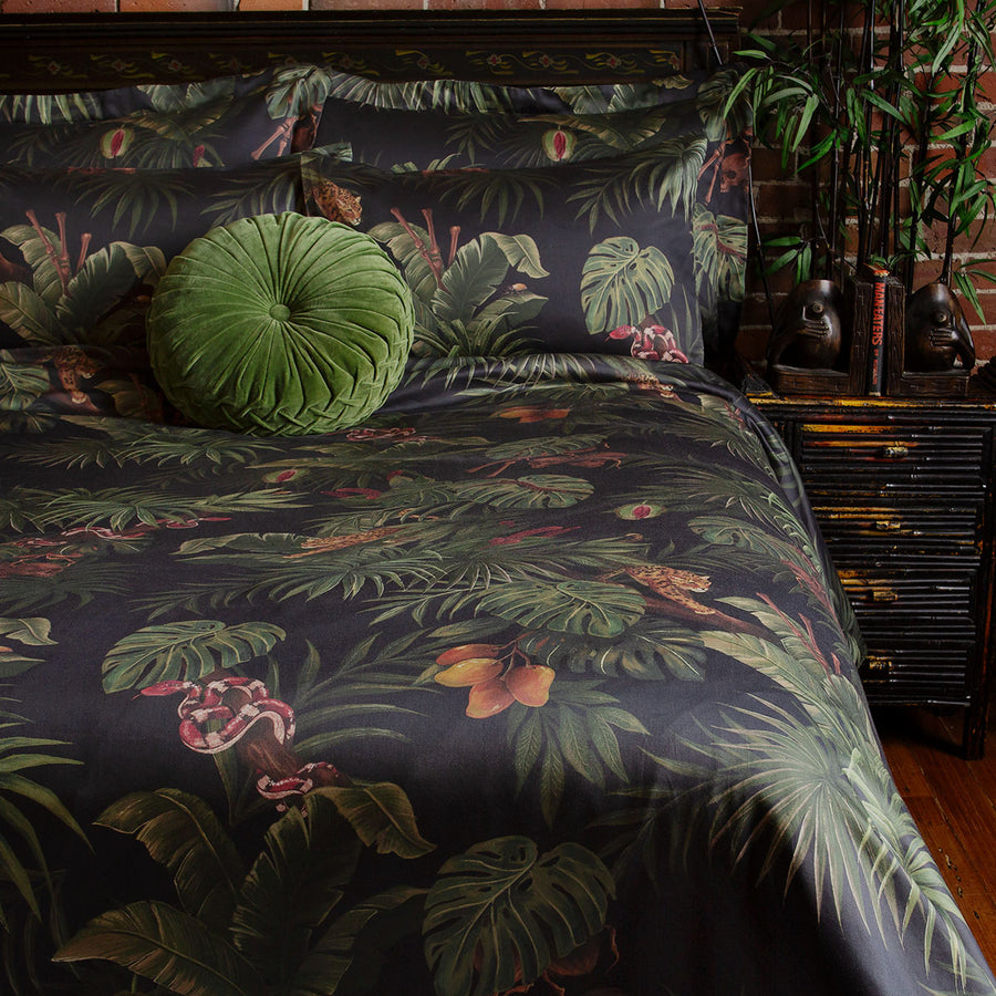 Sin in Linen's Tropical Gothic bedding and decor collection, Jungle Noir. Featuring lush botanicals, leopards, snakes, and vintage inspired elements, this 100% cotton collection includes duvet covers, pillowcases, curtains, and shower curtains. 