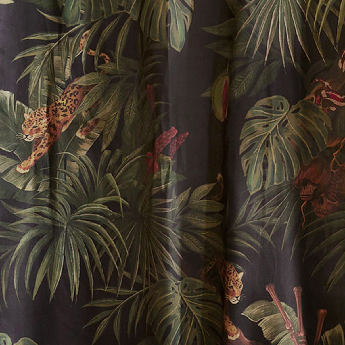 Swatch of Sin in Linen's Jungle Noir Print featuring prowling jaguars, lush foliage, and slithering serpents. Gothic Botanical decor with a tropical influence. 