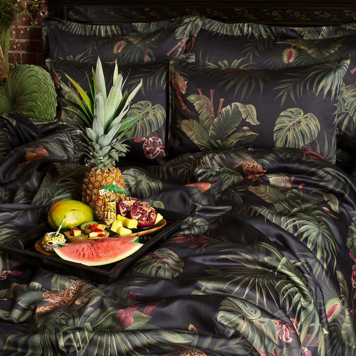 Sin in Linen's Tropical Gothic bedding and decor collection, Jungle Noir. Featuring lush botanicals, leopards, snakes, and vintage inspired elements, this 100% cotton collection includes duvet covers, pillowcases, curtains, and shower curtains. 