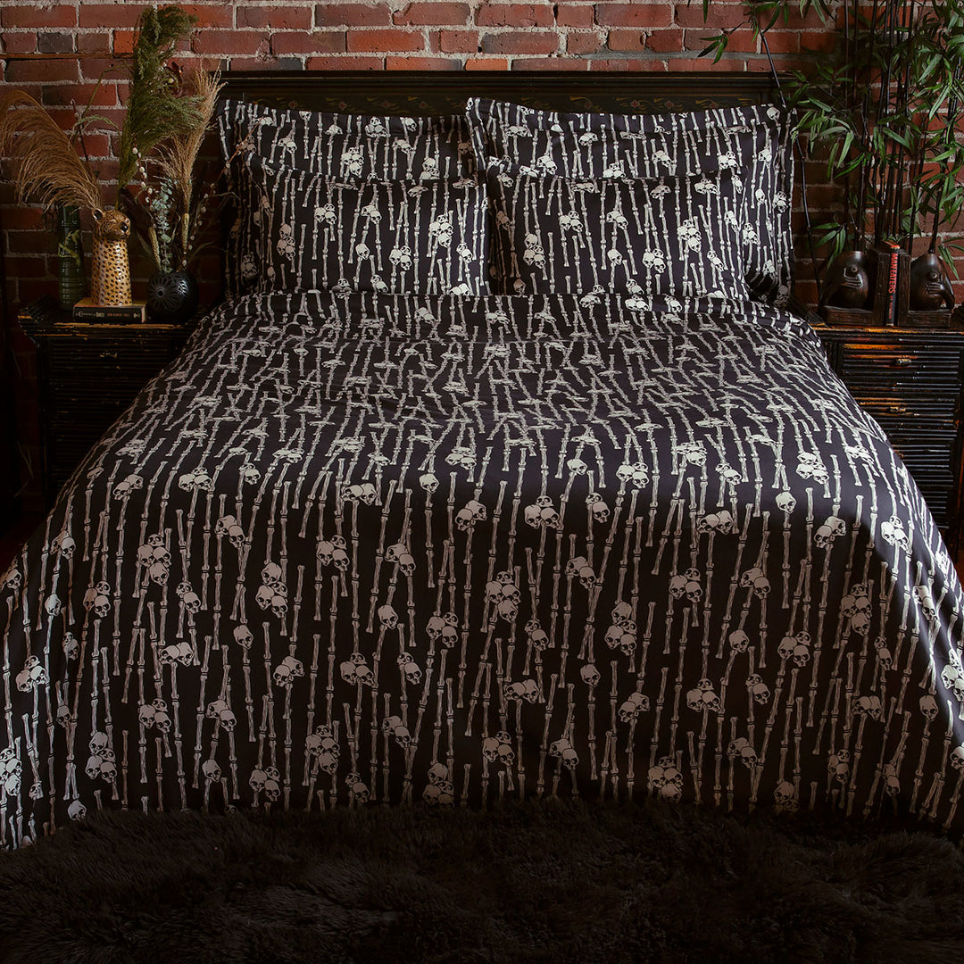 Sin in Linen's Bone Grove Bedding Collection. A bamboo-inspired print featuring hidden skulls for a gothic, vintage inspired bedroom.