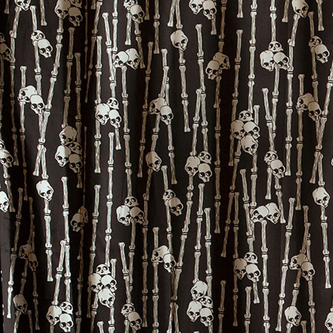 Sin in Linen's Bone Grove print featuring a bamboo forest with hidden skulls. Discover the gothic mystery with this tropical inspired collection. 