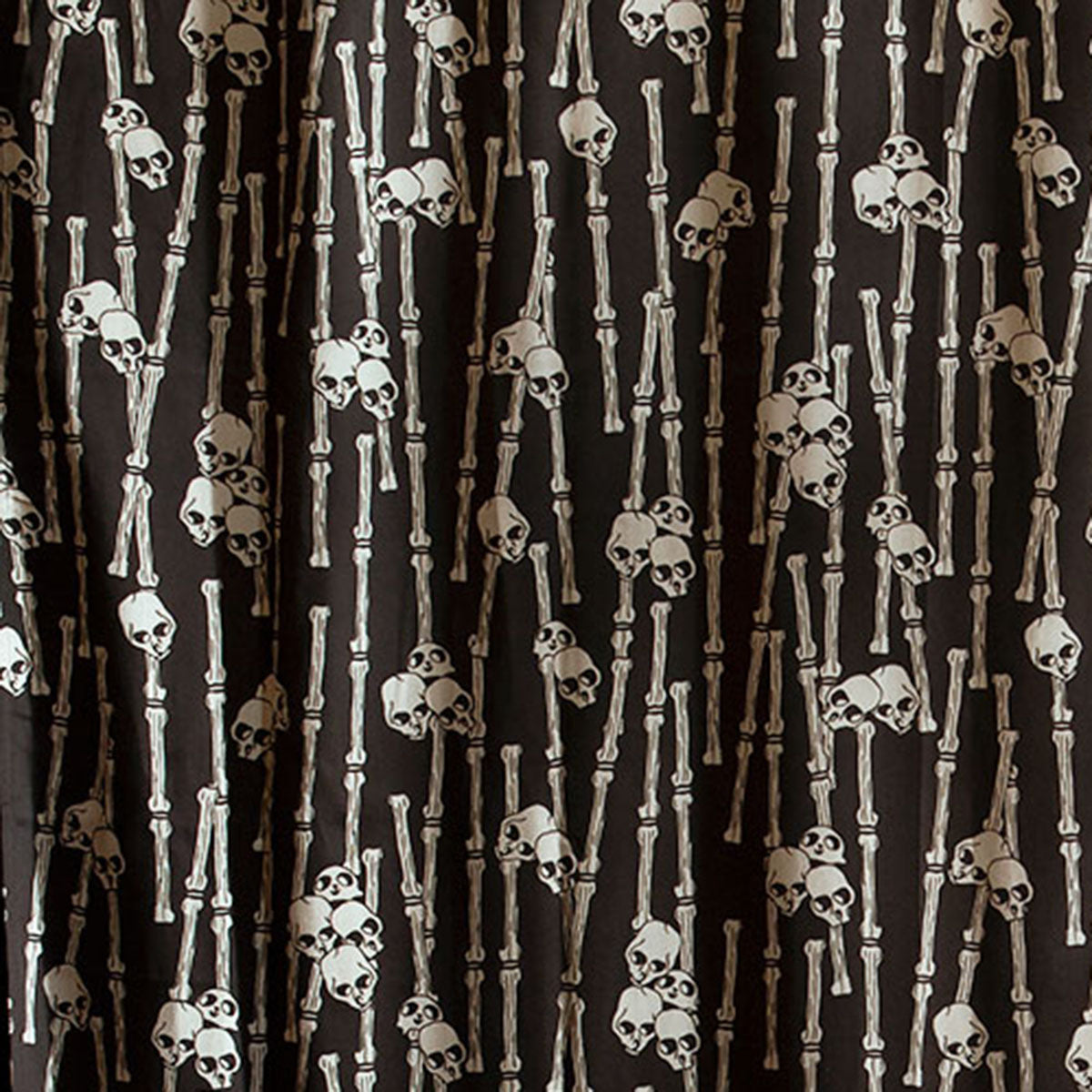 Sin in Linen's Bone Grove print featuring a bamboo forest with hidden skulls. Discover the gothic mystery with this tropical inspired collection. 