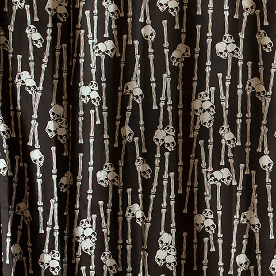Sin in Linen's Bone Grove print featuring a bamboo forest with hidden skulls. Discover the gothic mystery with this tropical inspired collection. 