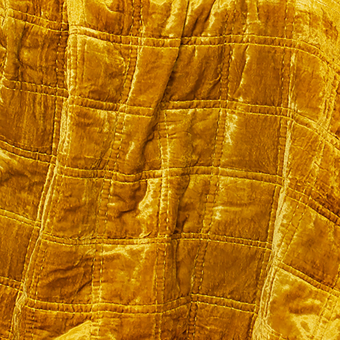 Gold quilted velvet fabric