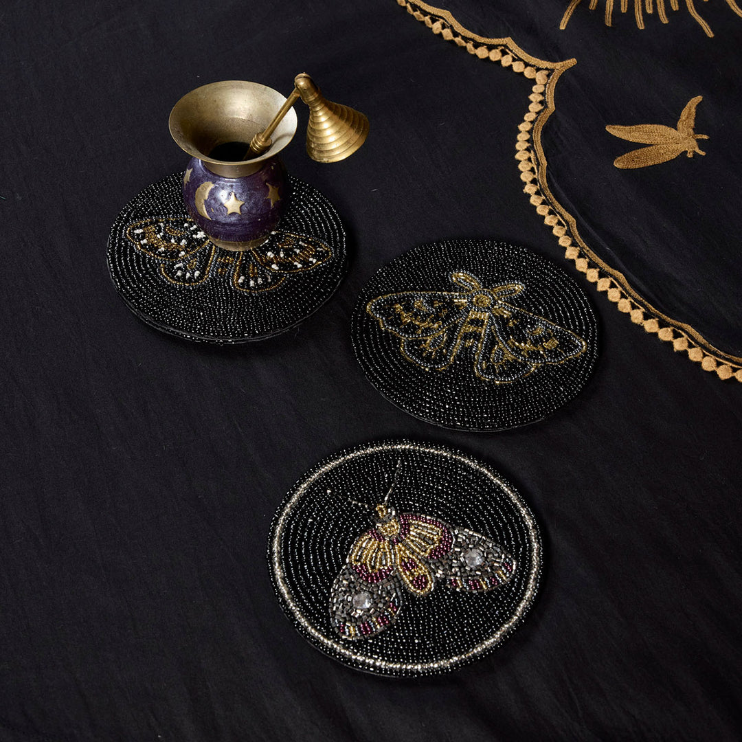 Sin in Linen's beaded Moth Coasters featuring intricate, colorful moths for your witchy, gothic botanical tables and living rooms. 