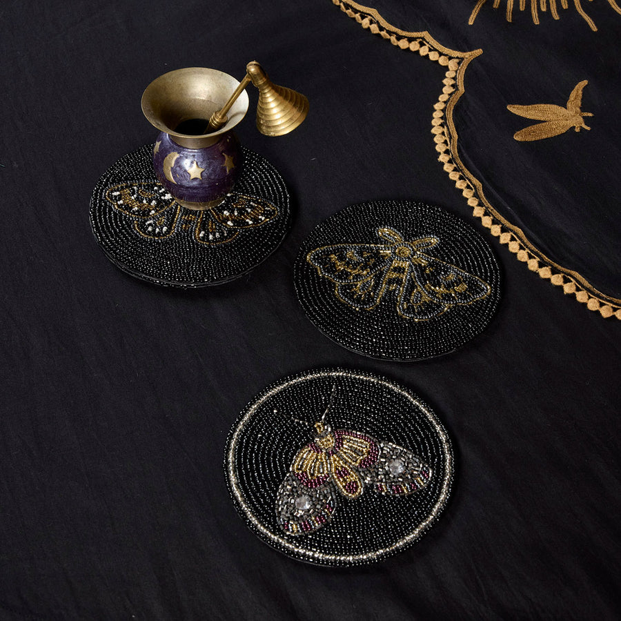 Sin in Linen's beaded Moth Coasters featuring intricate, colorful moths for your witchy, gothic botanical tables and living rooms. 