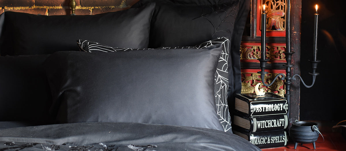 Sin in Linens Halloween Home collection featuring spider web bedding and spooky season favorites. 
