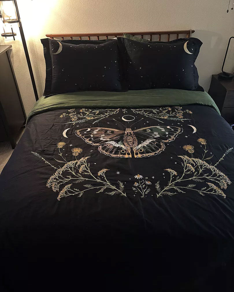 Midnight Moth Embroidered Duvet Cover from Sin in Linen featuring a moth, moon, and stars. 