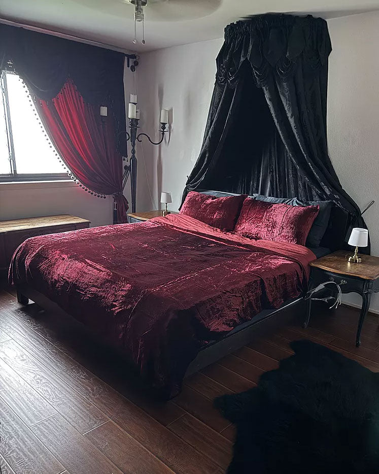 Red Velvet Bedding with matching tasseled curtains. 