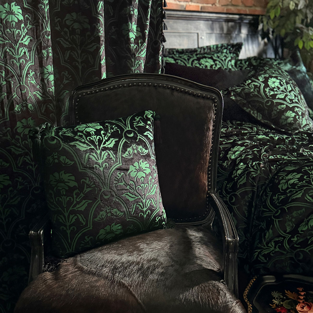 Sin in Linen's Velvet Datura Collection. Green gothic botanical pattern featuring datura blooms and bats in a flocked velvet design. Dark, witchy decor. 