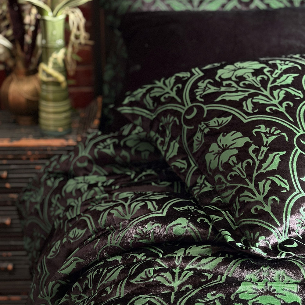 Sin in Linen's Velvet Datura pillowcases. Green gothic botanical pattern featuring datura blooms and bats in a flocked velvet design. Dark, witchy decor. 