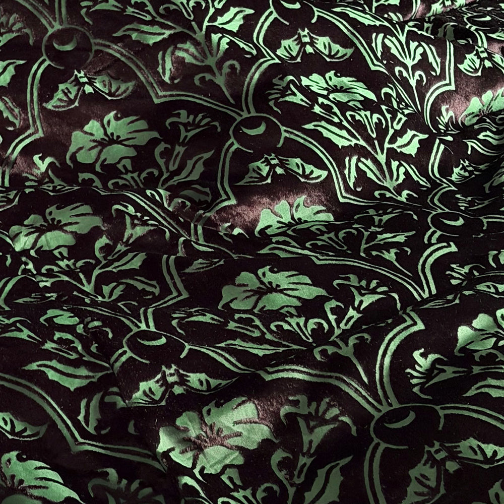Sin in Linen's Velvet Datura fabric. Green gothic botanical pattern featuring datura blooms and bats in a flocked velvet design. Dark, witchy decor. 