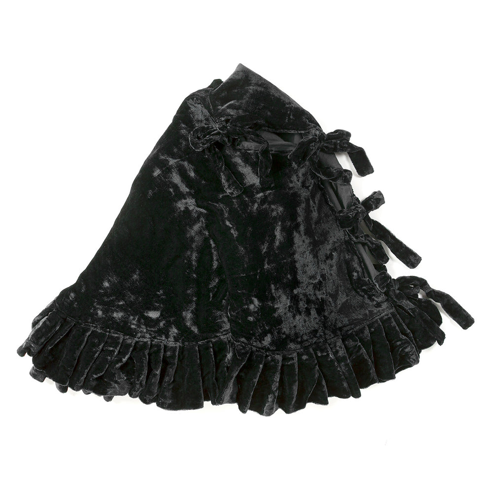 Black velvet tree skirt on a white background.