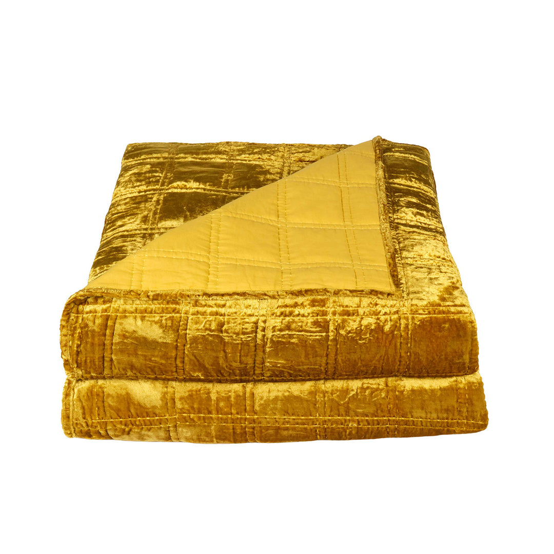 Gold velvet box quilt on a white background. Bohemian, witchy velvet decor. 
