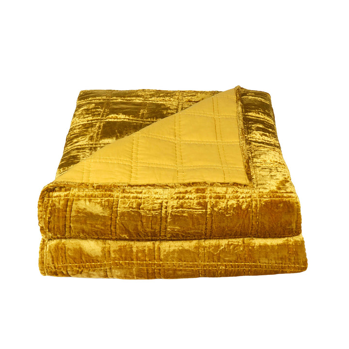 Gold velvet box quilt on a white background. Bohemian, witchy velvet decor. 