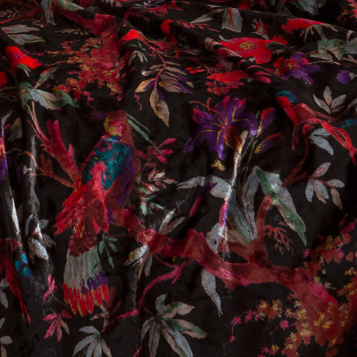 Swatch of Sin in Linen's velvet parrot fabric used for robes and blankets. 