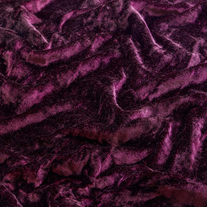 Close-up of purple textured fabric used for Sin in Linen's velvet curtains.
