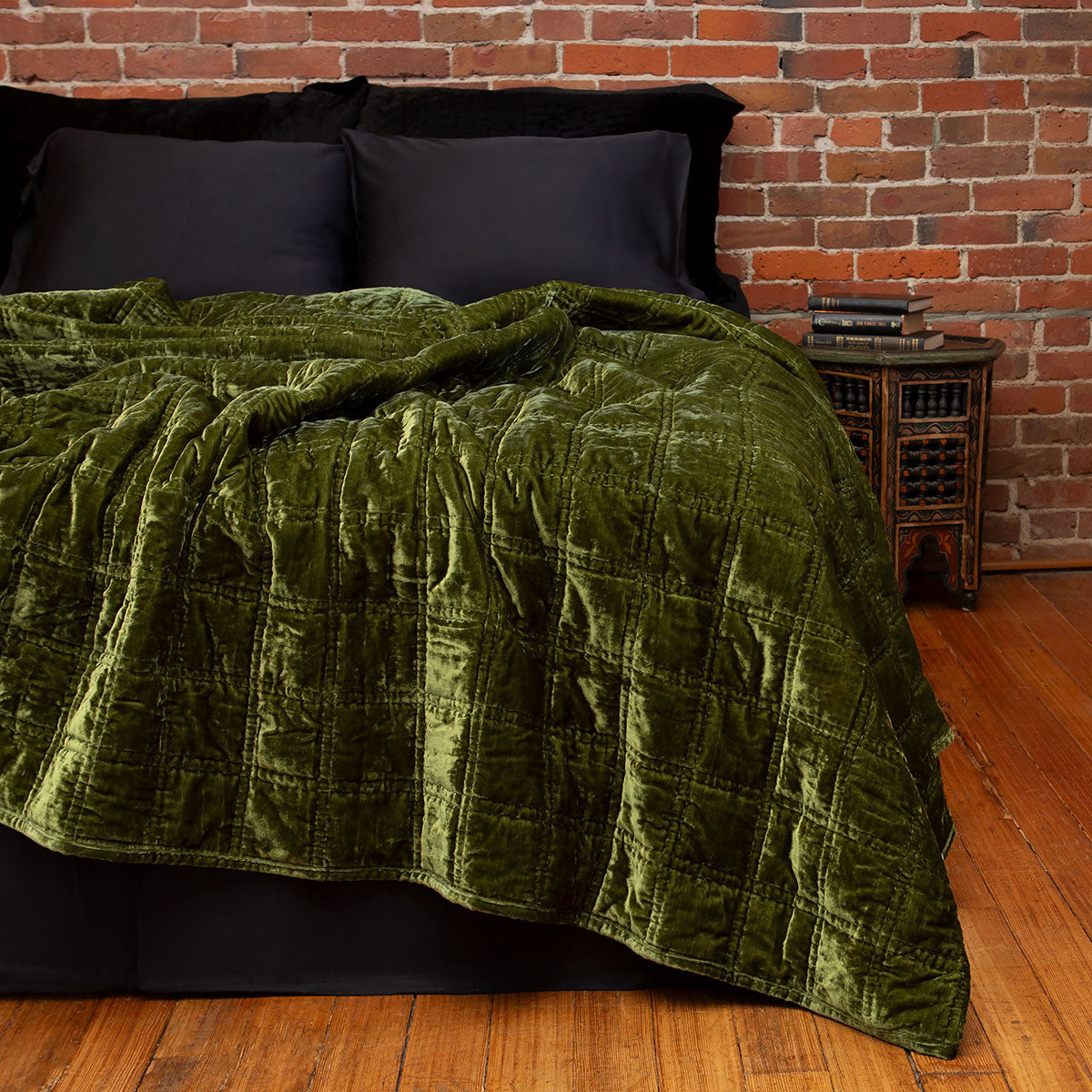Velvet box quilt in moss green. Lush, botanical inspired velvet bedding.