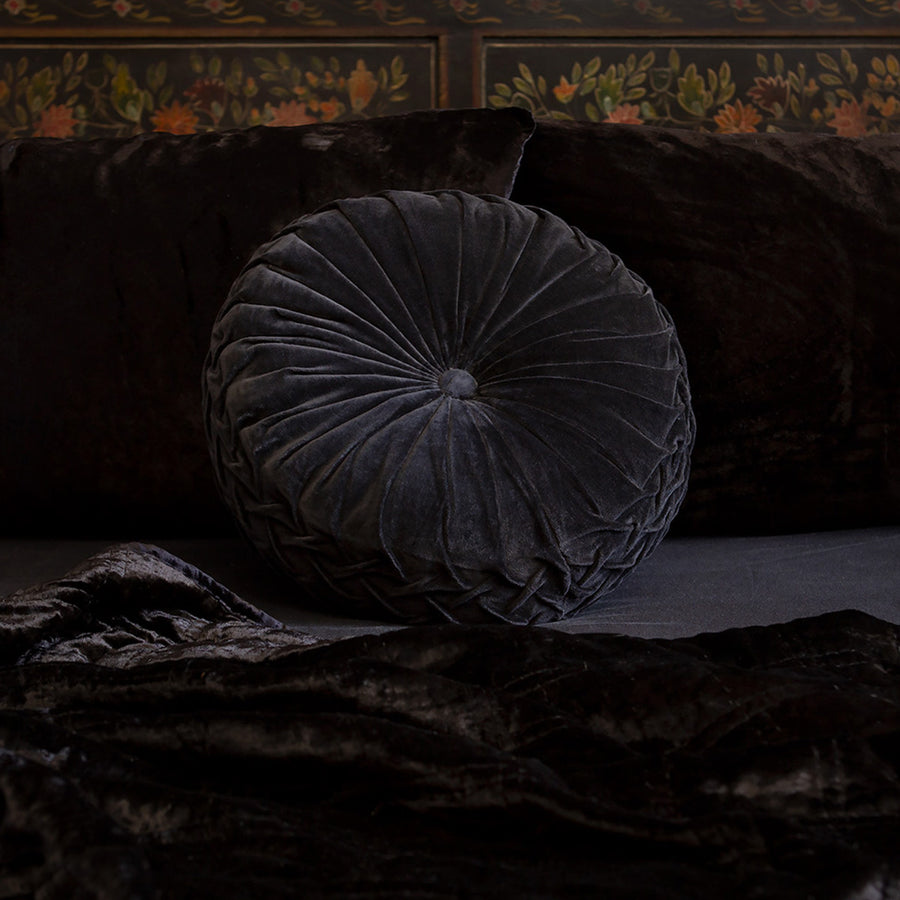 Black velvet pintuck pillow on a bed of black velvet bedding. Luxurious throw pillows by Sin in Linen.