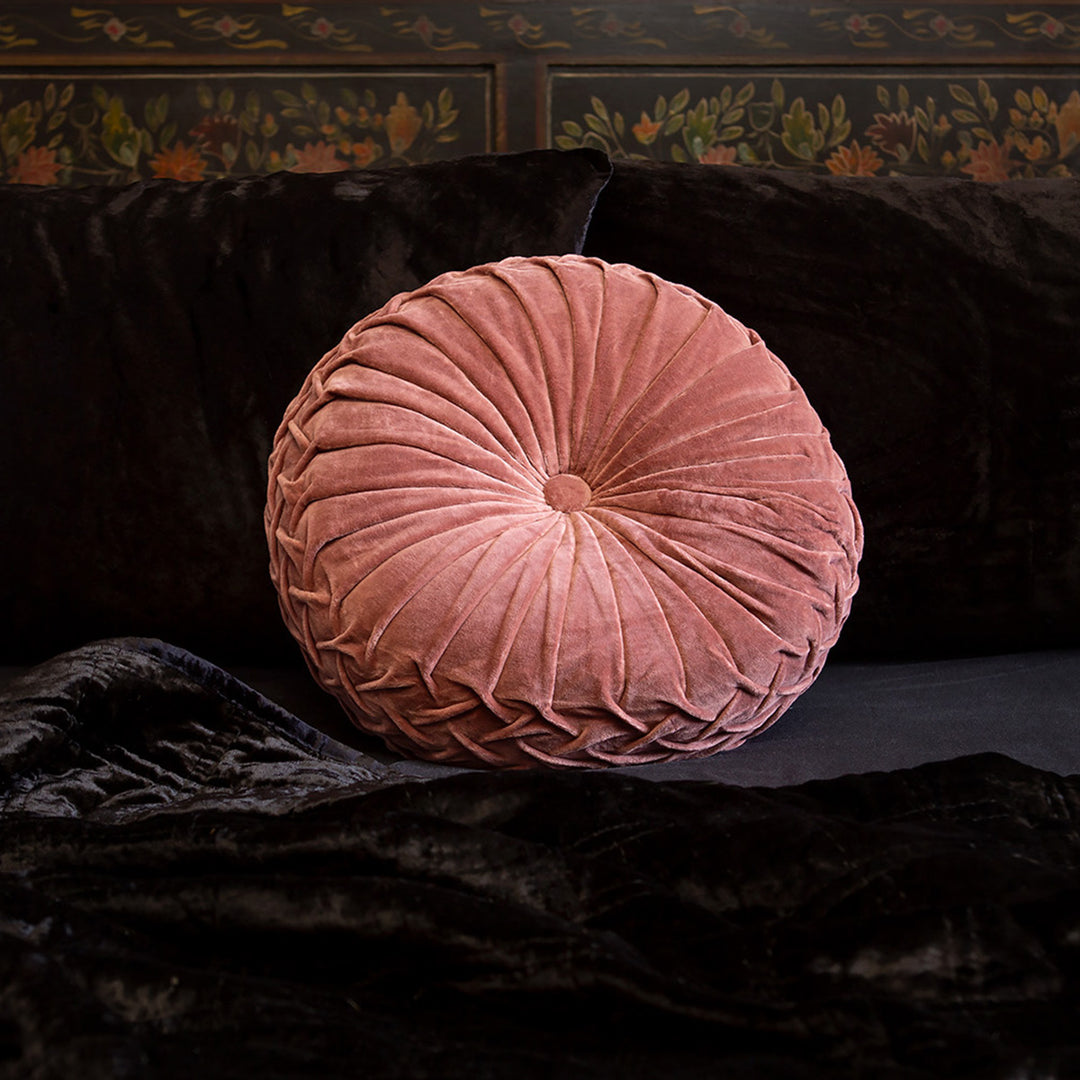Dusty rose pink velvet pintuck pillow on a bed of black velvet bedding. Luxury throw pillows by Sin in Linen. 