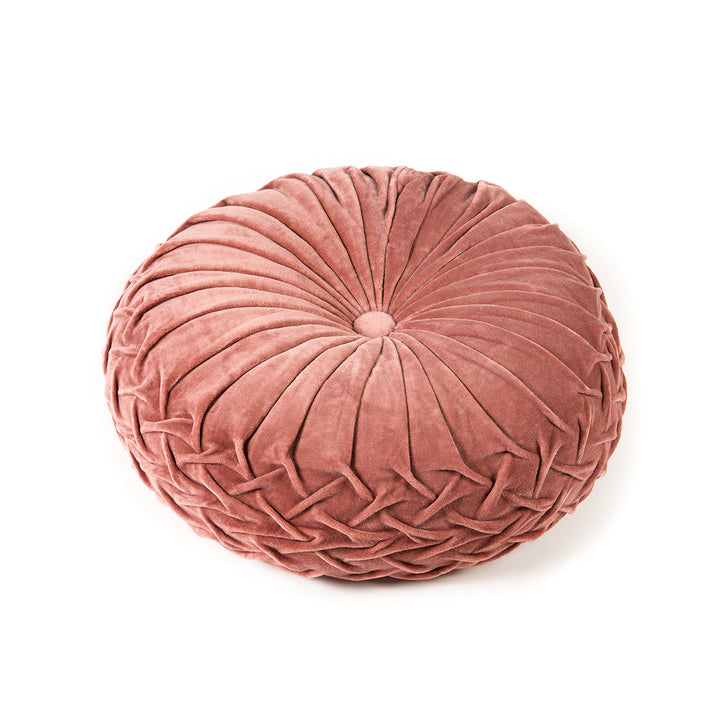 Rose pink velvet round pintuck pillow on a white background.